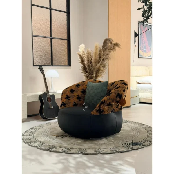 Mid-Century Houndstooth and Leather Round Lounge Chair in black — in a room setting