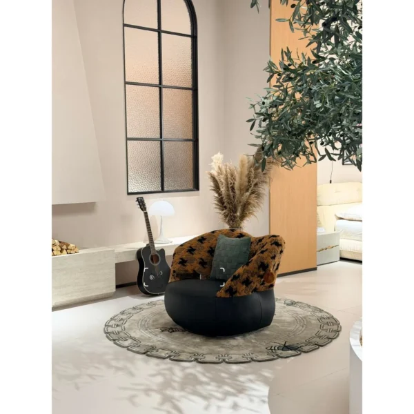 Mid-Century Houndstooth and Leather Round Lounge Chair in black — in a room setting