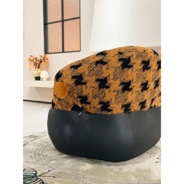 Mid-Century Houndstooth and Leather Round Lounge Chair in black — in a room setting