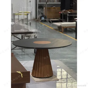 Mid-Century Round Dining Table in black — in a room setting