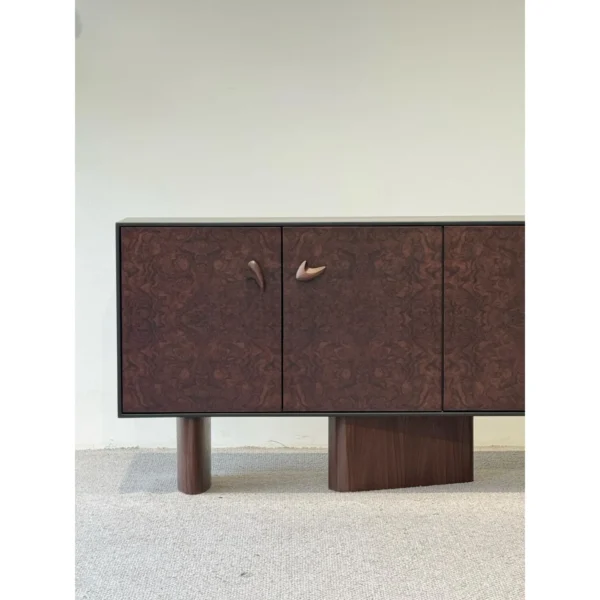 Mid-Century Burl Veneer Entryway Cabinet with Sculpted Pulls in clay — in a room setting