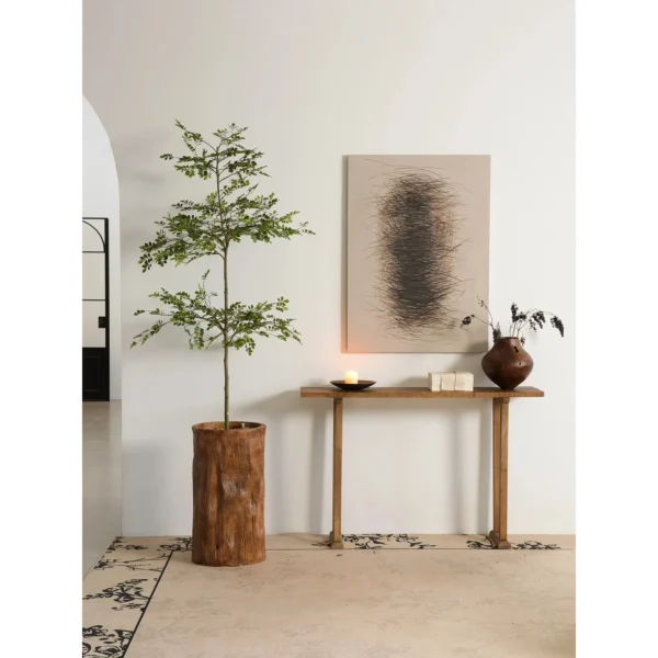 Wabi-Sabi Brass Console Table in brushed brass — in a room setting