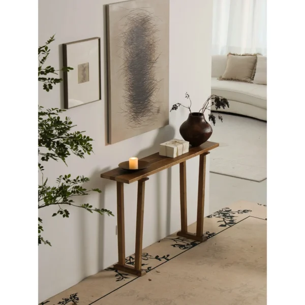 Wabi-Sabi Brass Console Table in brushed brass — in a room setting