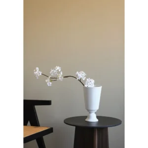Mid-Century White Ceramic Vase with Inverted Cone Body in ivory — in a room setting