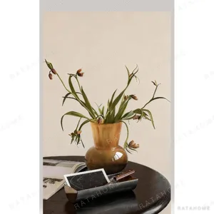Amber Glass Wide-Mouth Vase with Bulbous Base in clay — in a room setting