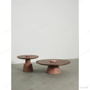 Red Travertine and Walnut Pedestal Coffee Table Pair, 95 in rust — in a room setting