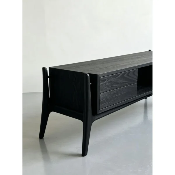 Minimalist Black Ash TV Stand with Angled Legs, 180 cm in black — in a room setting