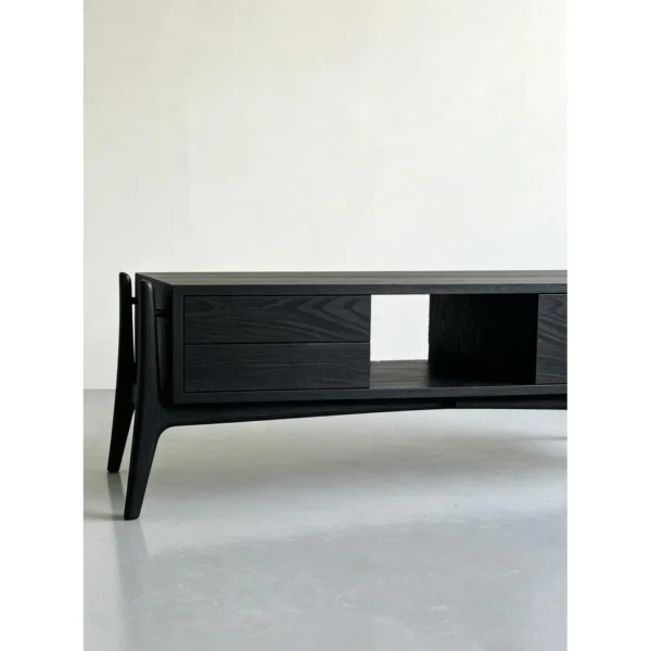 Minimalist Black Ash TV Stand with Angled Legs, 180 cm in black — in a room setting