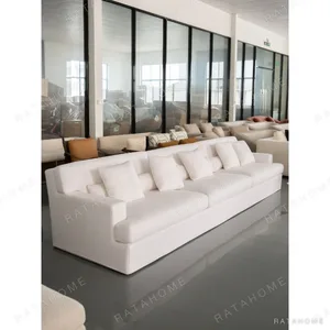 Minimalist Cream White Block Sofa with Deep Seats in oatmeal — in a room setting