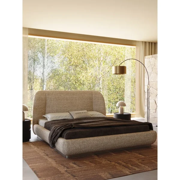 Curved Embrace Linen Bed on Floating Metal Base in sand — in a room setting