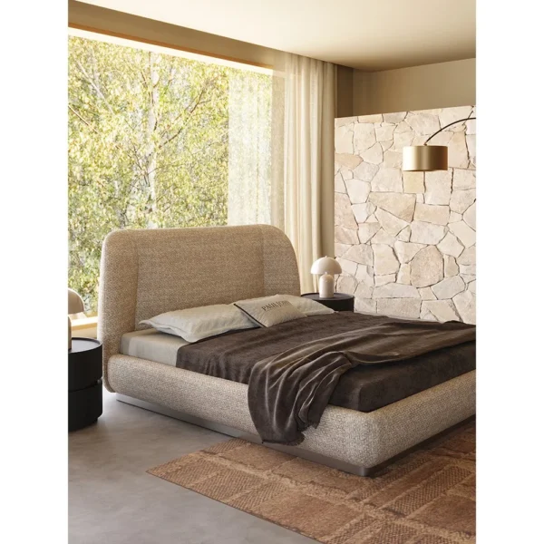 Curved Embrace Linen Bed on Floating Metal Base in sand — in a room setting
