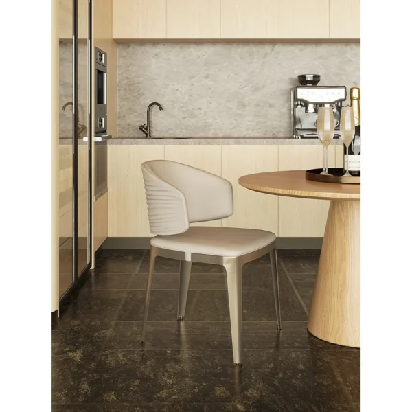 Round Oak Dining Table with Gilt-Detail Leather Chairs in natural oak — in a room setting