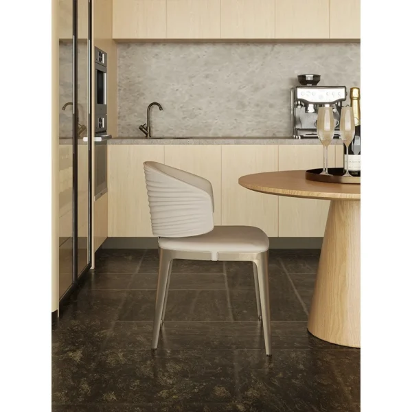 Round Oak Dining Table with Gilt-Detail Leather Chairs in natural oak — in a room setting