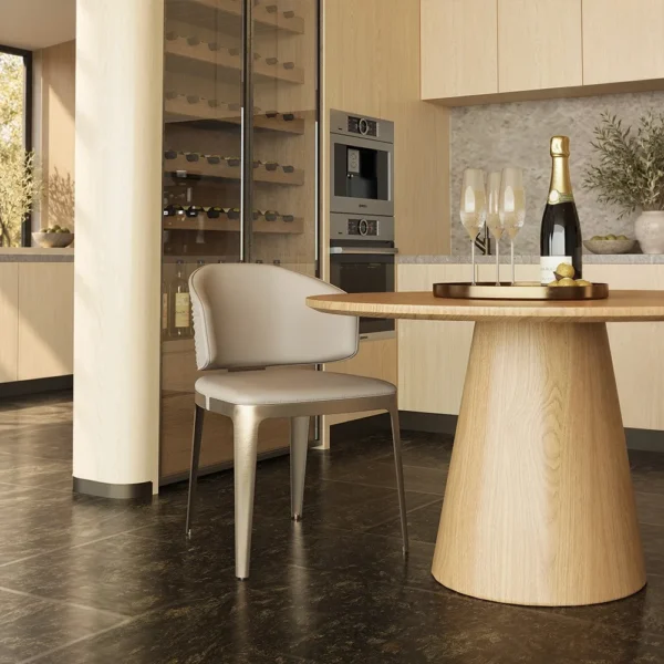 Round Oak Dining Table with Gilt-Detail Leather Chairs in natural oak — in a room setting