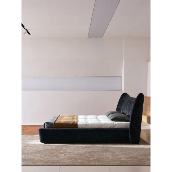 Fishtail Curved-Headboard Chenille Bed in black — in a room setting