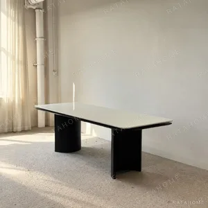 Long White Crystal Marble Dining Table on Curved Black Base in ivory — front view