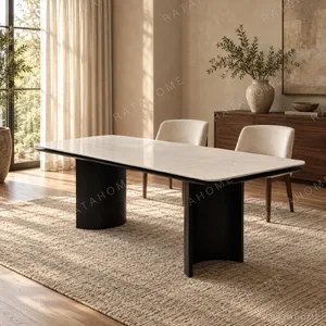 Long White Crystal Marble Dining Table on Curved Black Base in ivory — in a room setting