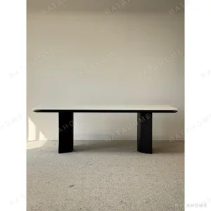 Long White Crystal Marble Dining Table on Curved Black Base in ivory — in a room setting