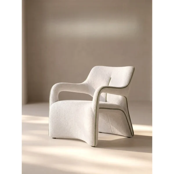 Jianxu White Bouclé Lounge Chair with Green Piping in ivory — in a room setting