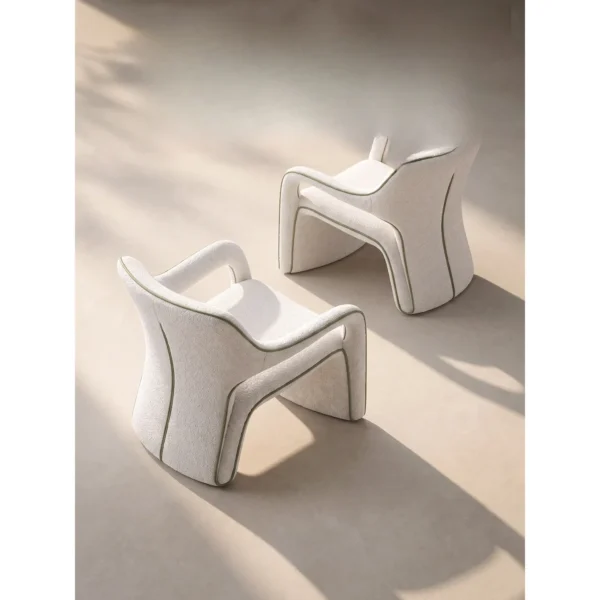 Jianxu White Bouclé Lounge Chair with Green Piping in ivory — in a room setting