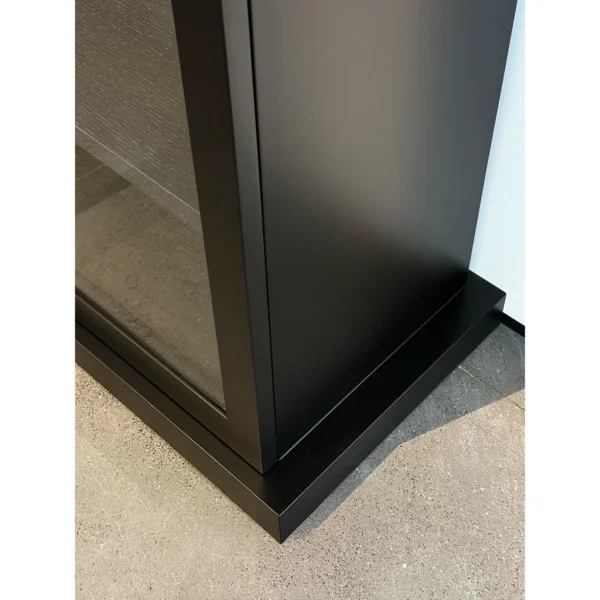 Black Wood Display Cabinet in black — in a room setting