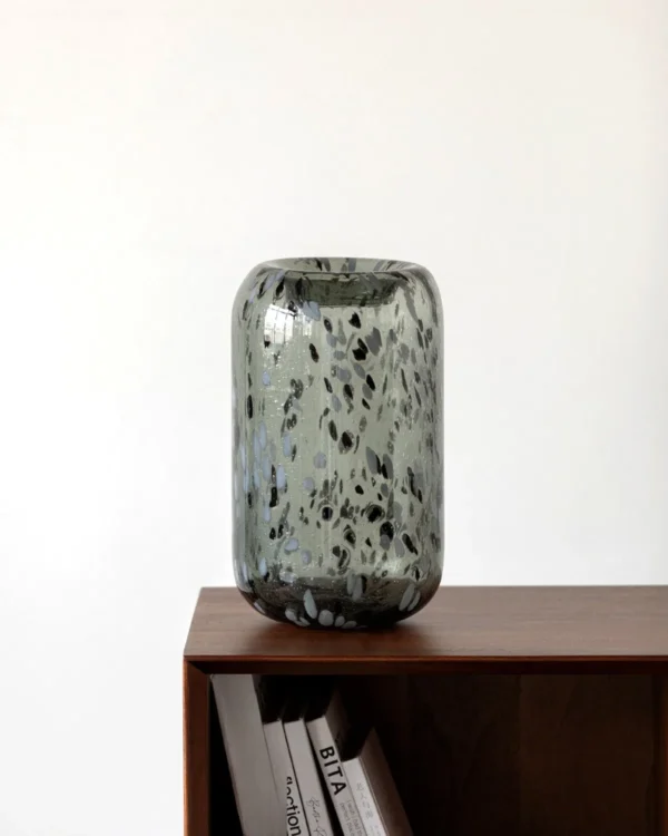 Hand-Made Mist Grey Speckled Tall Glass Vase in slate — in a room setting