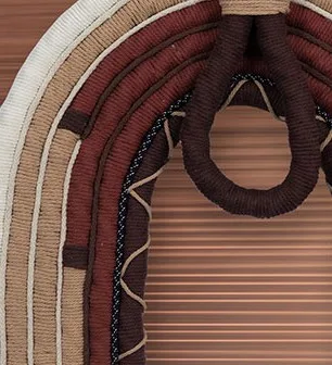 Woven Arch Fibre Wall Hanging in burgundy — detail