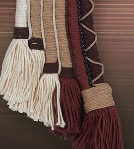 Woven Arch Fibre Wall Hanging in burgundy — detail