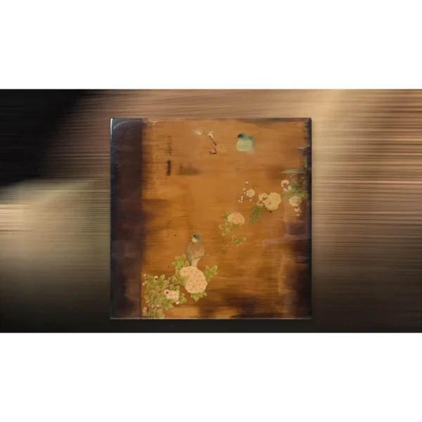 Bird and Blossom on Amber Lacquer Panel, 80 x 80 cm in brushed brass — in a room setting