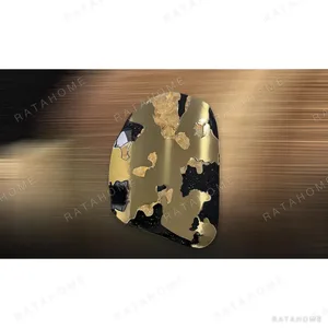 Pebble Gold and Black Lacquer Panel, 85 x 120 cm in brushed brass — in a room setting