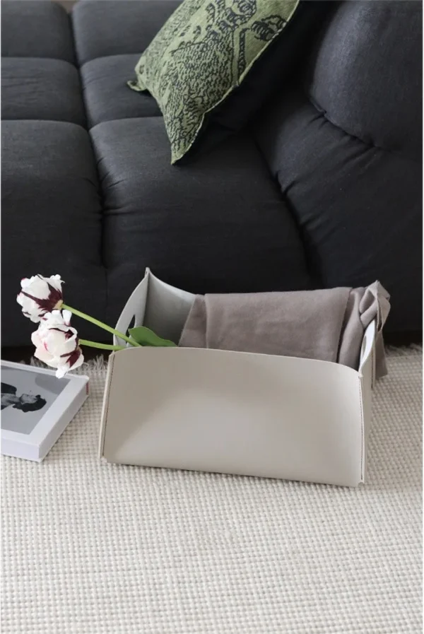Cream Leather Rectangular Storage Box with Cut-Out Handles in oatmeal — in a room setting