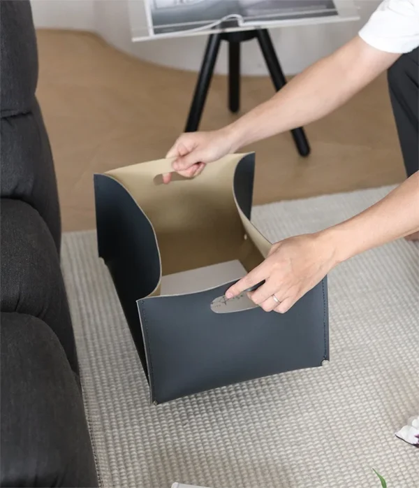 Cream Leather Rectangular Storage Box with Cut-Out Handles in oatmeal — in a room setting
