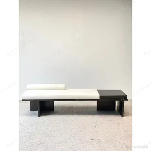 Minimal Black and Cream Bed-End Bench in black — in a room setting