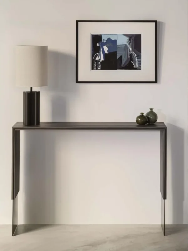 Ebony-Veneer Waterfall Console with Metal Feet in black — in a room setting