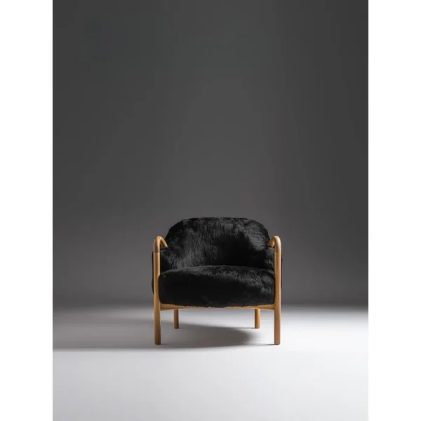 Ink Wave Wood Frame Lounge Chair in Black Fur — in a room setting