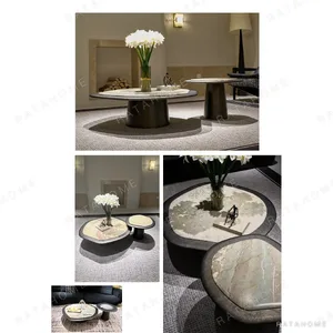 Monet Garden Stone Nesting Coffee Tables with Rolled Edges in rose stone — in a room setting