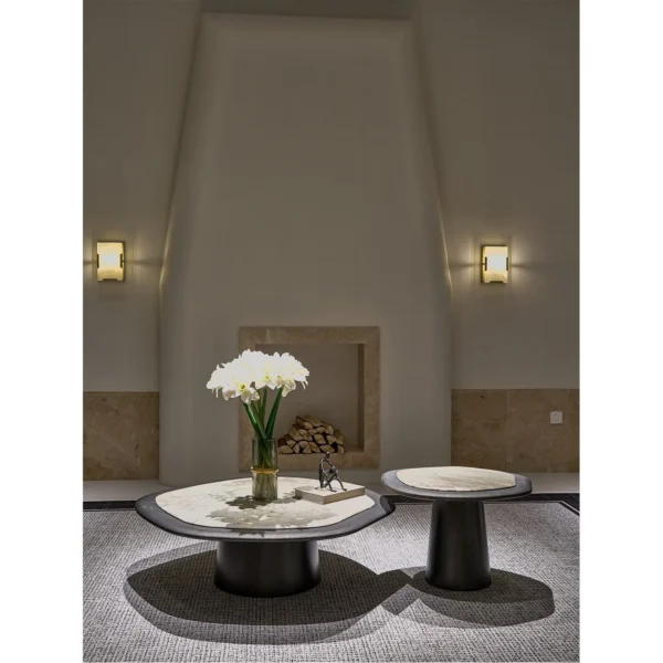 Monet Garden Stone Nesting Coffee Tables with Rolled Edges in rose stone — in a room setting