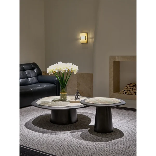 Monet Garden Stone Nesting Coffee Tables with Rolled Edges in rose stone — in a room setting