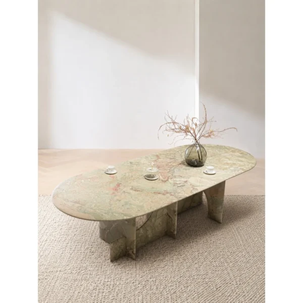 Monet Garden Green and Pink Stone Oval Dining Table in olive — in a room setting