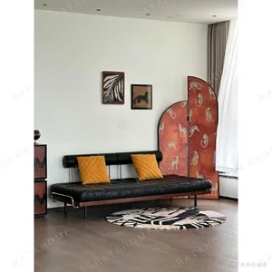 Moni Three-Way Sofa Bed in Black Leather on Slim Steel Frame — in a room setting