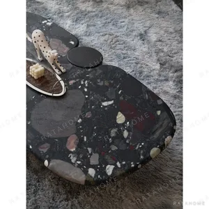 Moonlit Stars Marble Pebble Coffee Table Set in black — in a room setting