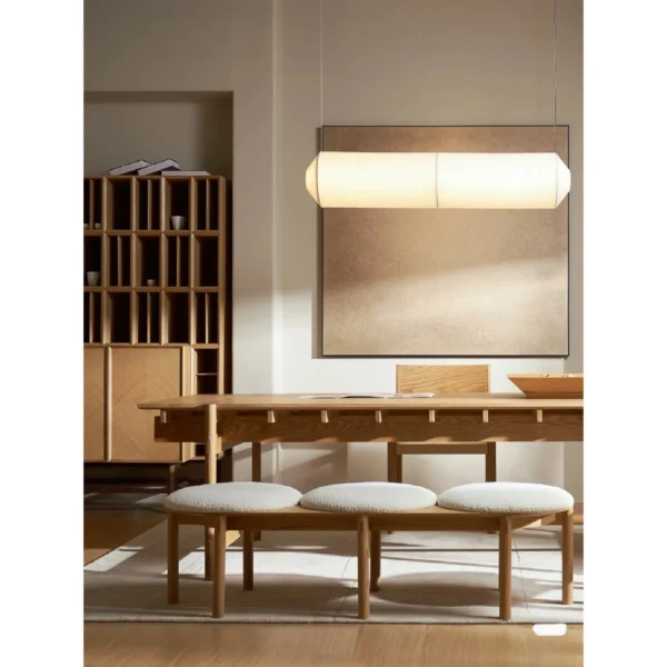 Mortise-and-Tenon Long Dining Table with Stools in natural oak — in a room setting
