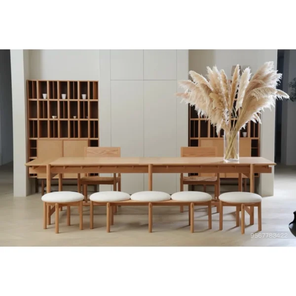 Mortise-and-Tenon Long Dining Table with Stools in natural oak — in a room setting