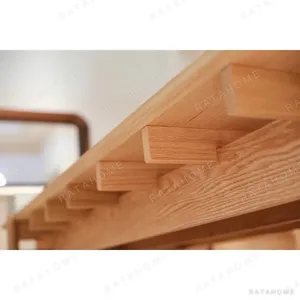Mortise-and-Tenon Long Dining Table with Stools in natural oak — in a room setting