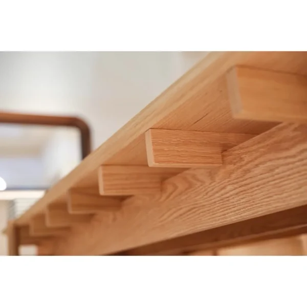 Mortise-and-Tenon Long Dining Table with Stools in natural oak — in a room setting