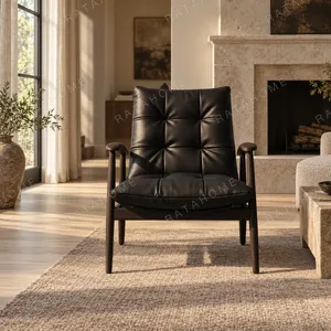 Brook Black Solid Wood Armchair with Tufted Leather Cushions in black — in a room setting