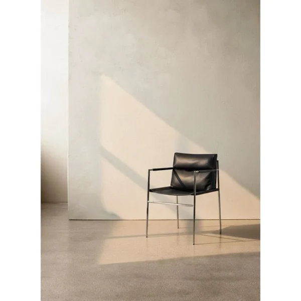 Stalform Black Leather Lounge Chair on Square Steel Frame in black — in a room setting