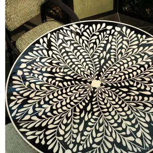 Mother-of-Pearl Inlaid Round Dining Table in black — in a room setting