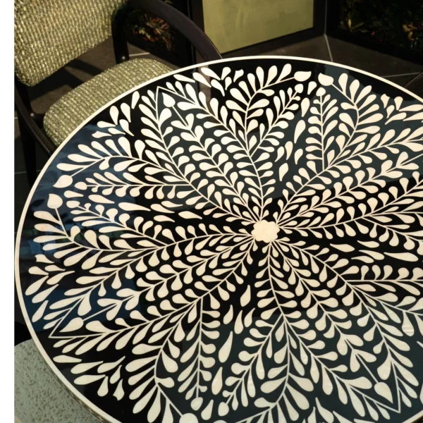 Mother-of-Pearl Inlaid Round Dining Table in black — in a room setting
