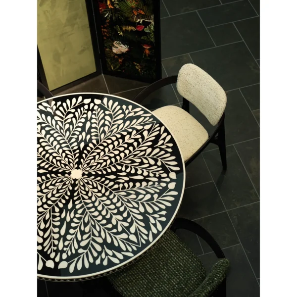 Mother-of-Pearl Inlaid Round Dining Table in black — in a room setting